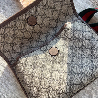 Patterned fabric with a prominent brand logo on a textured surface