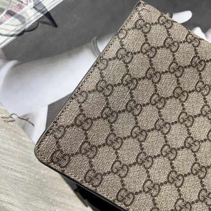 Close-up of a Gucci patterned product on a textured surface