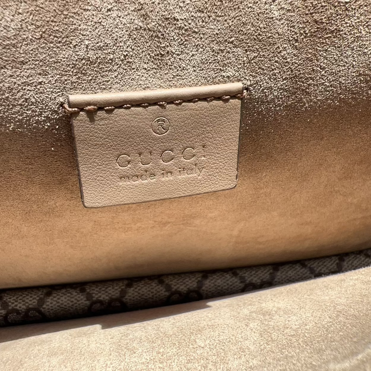 Close-up of a Gucci handbag with the brand logo.
