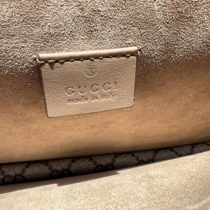 Close-up of a Gucci handbag with the brand logo.