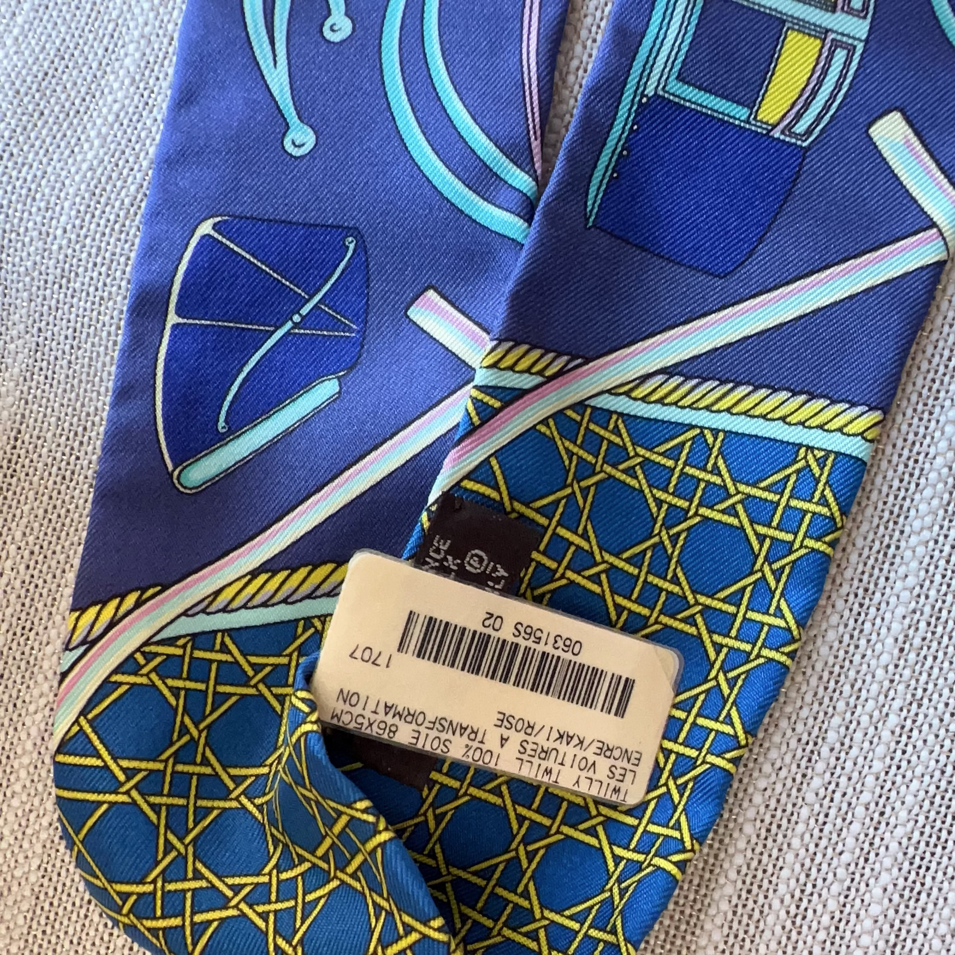 Blue and yellow patterned shoe with a visible brand tag on a textured surface