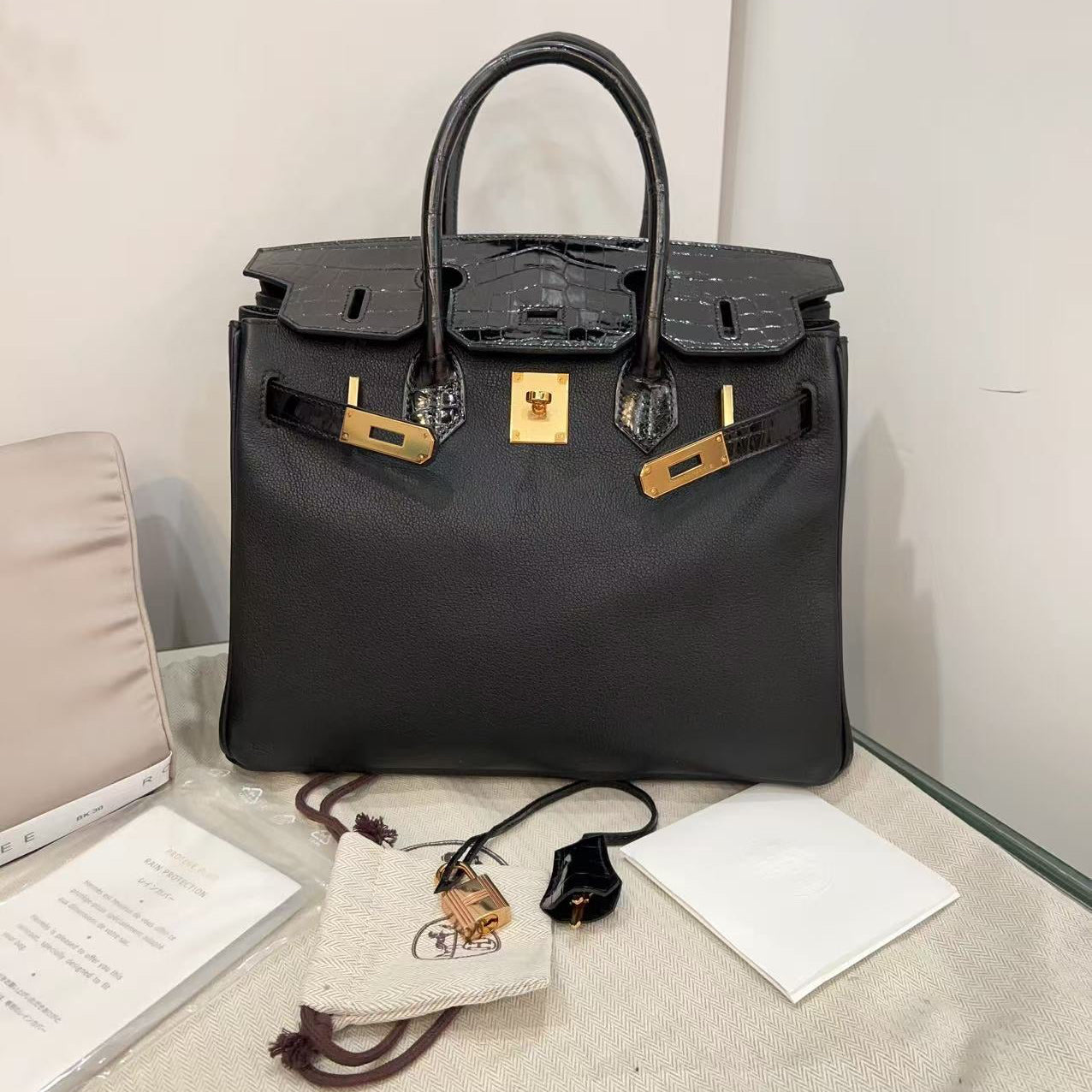 Black handbag with gold hardware 