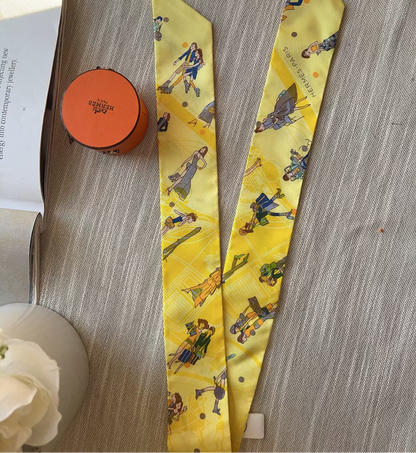 Yellow necktie with cartoon characters on a wooden surface