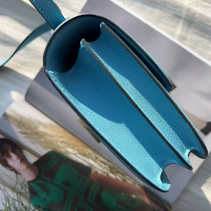 Blue metal tool on a white surface