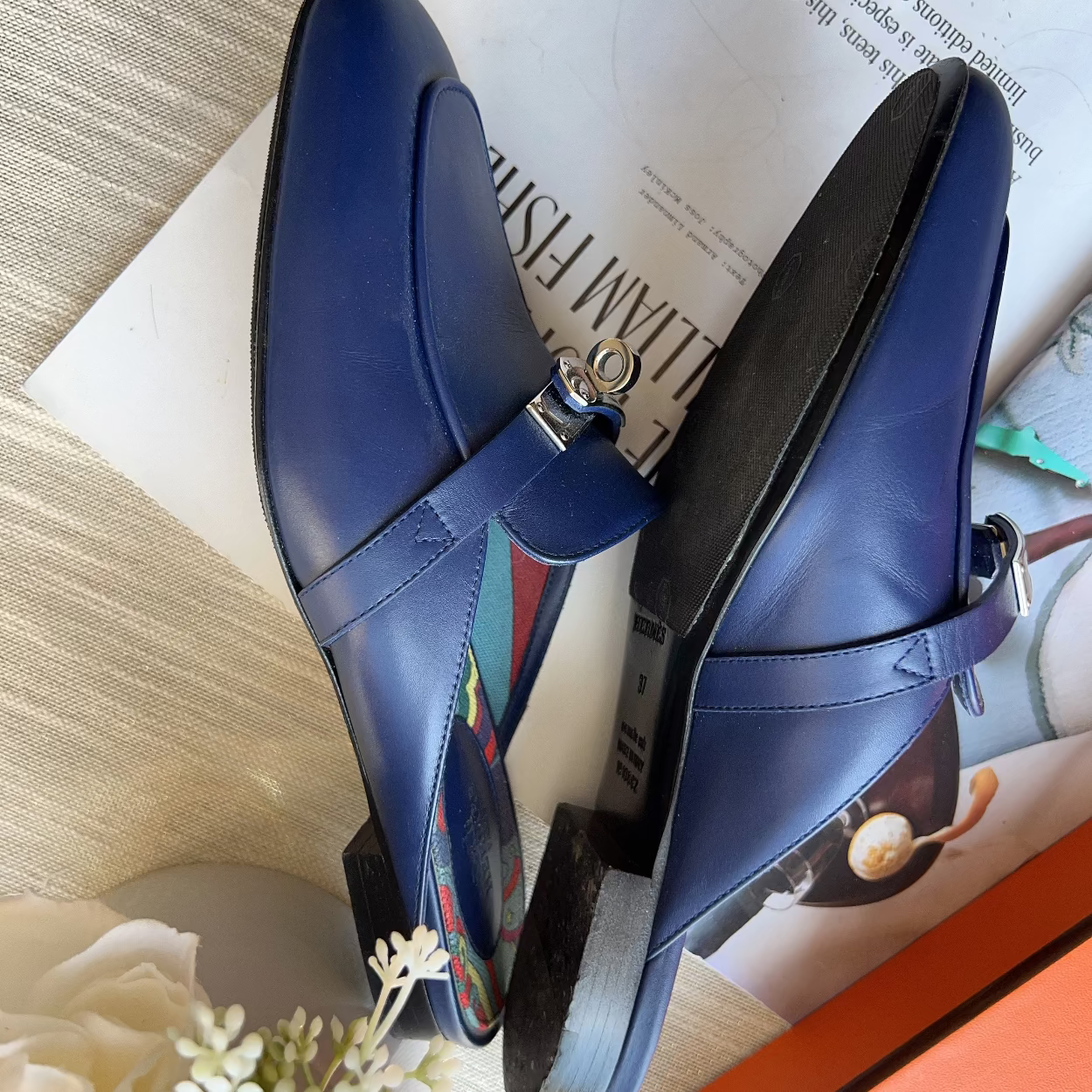 Blue shoes with colorful interior on a magazine