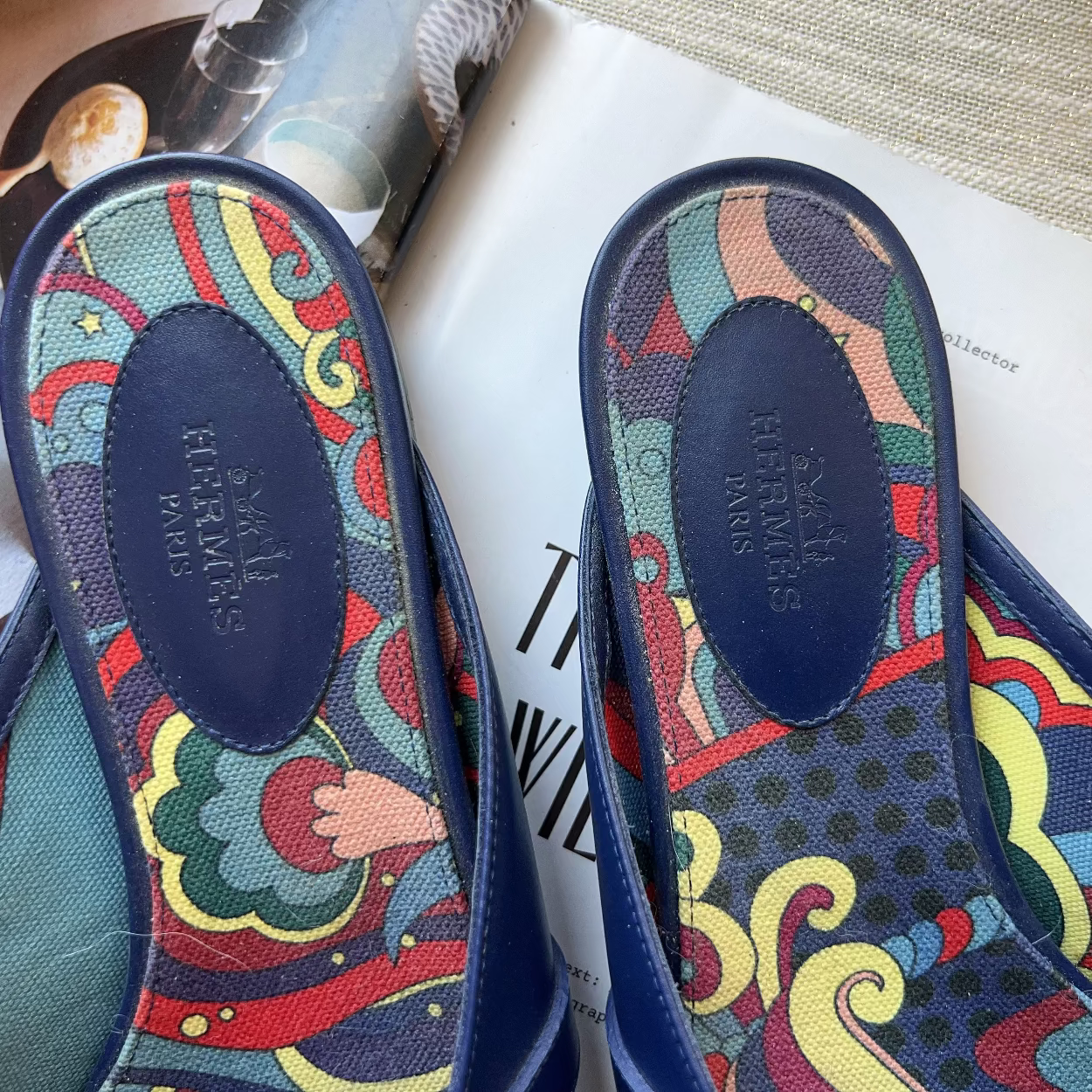 Colorful sandal insoles with brand name on a magazine background