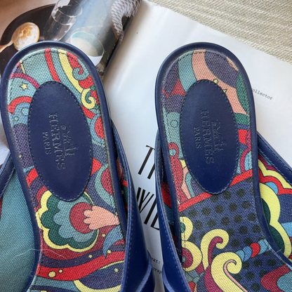 Colorful sandal insoles with brand name on a magazine background