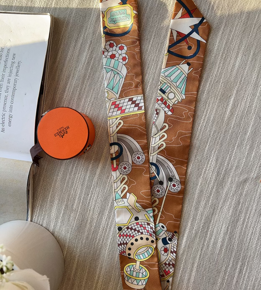 Decorative tie with intricate patterns on a textured surface