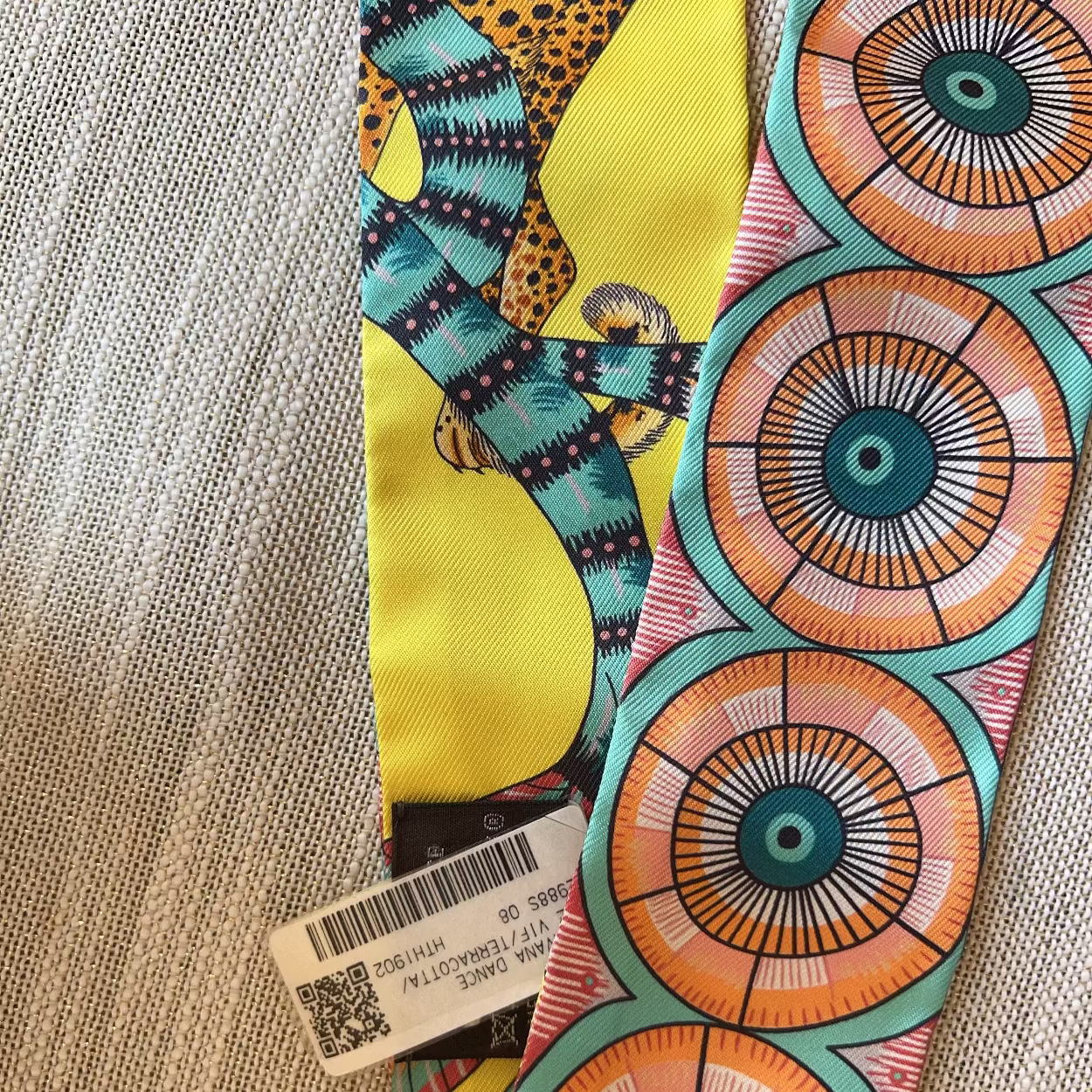 Colorful fabric with geometric patterns on a textured surface