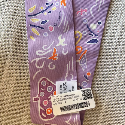Purple tie with abstract patterns on a textured fabric background