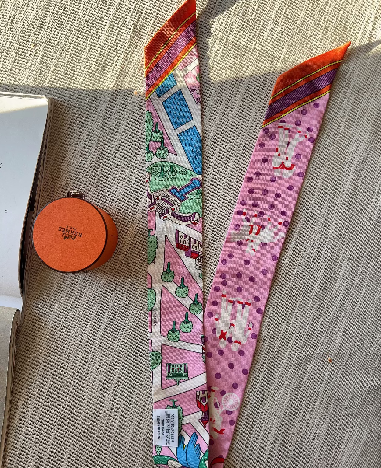 Two colorful fabric strips with patterns on a wooden surface