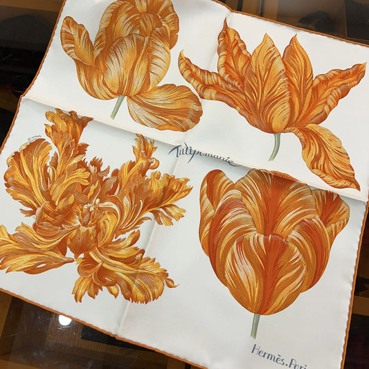 Floral design on a white background with an orange box in the background
