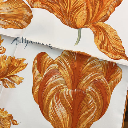Close-up of orange floral design on a white background