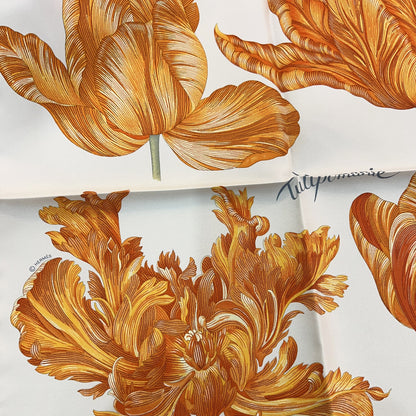 Close-up of a floral pattern with gold leaves on a white background