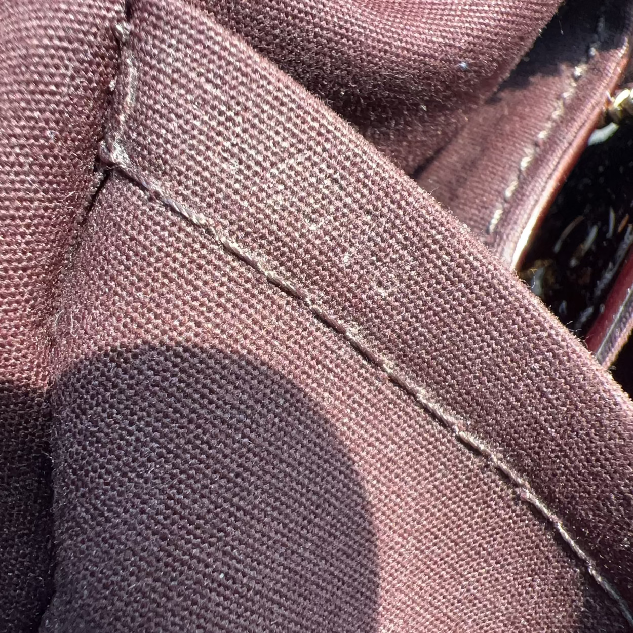 Close-up of a brown fabric with stitching details