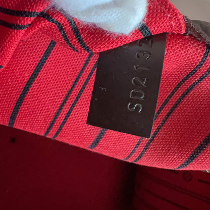 Red plaid fabric with a black label displaying 'SD213' on a white background