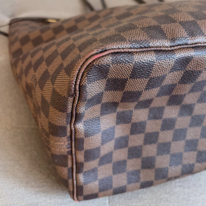 Checkered patterned handbag on a light background