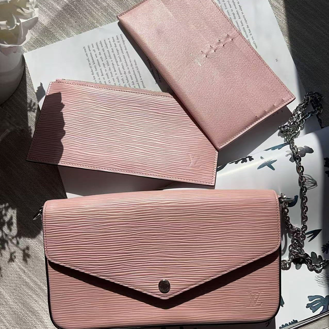 Pink textured wallet with a chain 