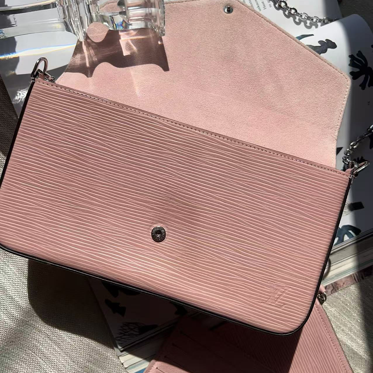 Pink textured handbag on a surface