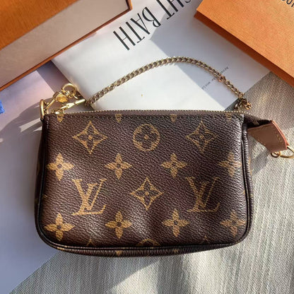 Louis Vuitton handbag with monogram pattern on a light surface