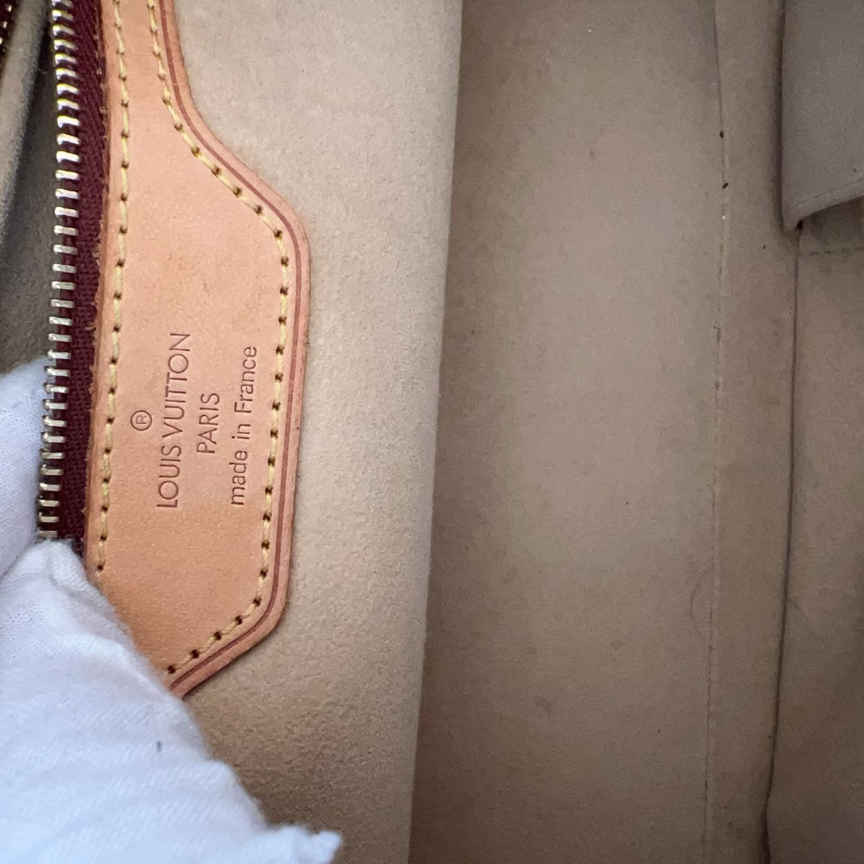 Close-up of a Louis Vuitton bag with a visible brand logo.