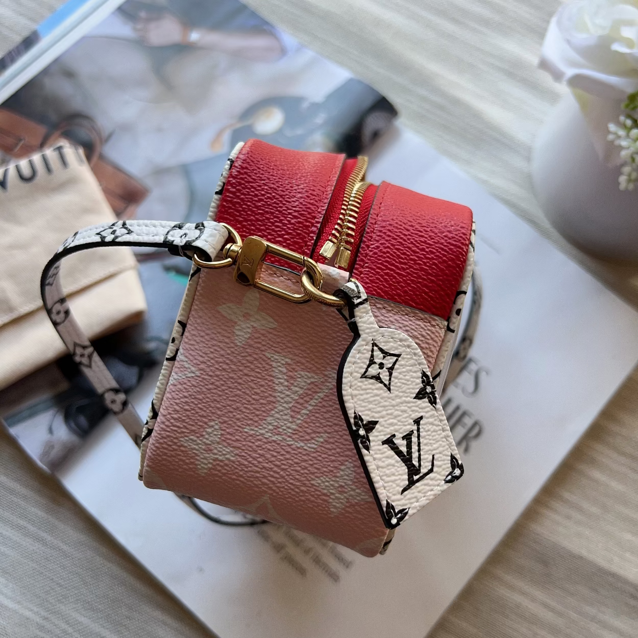 Louis Vuitton keychain on a magazine with a blurred background