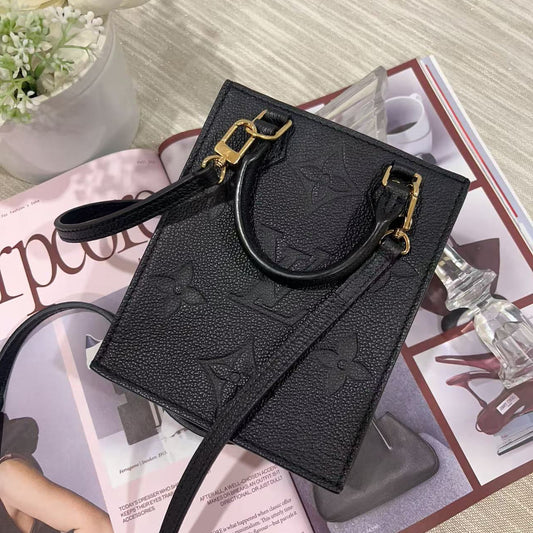 Black handbag with gold accents 