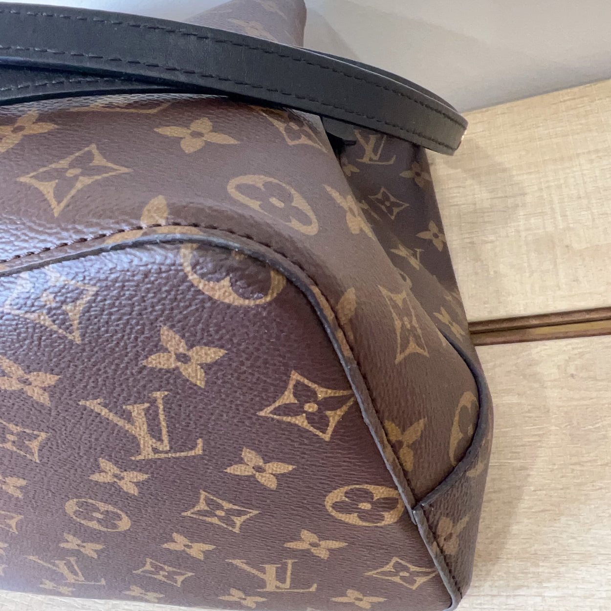 Louis Vuitton monogram handbag on a light-colored surface