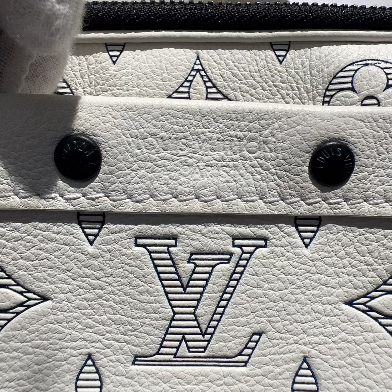 Close-up of a Louis Vuitton handbag with monogram pattern
