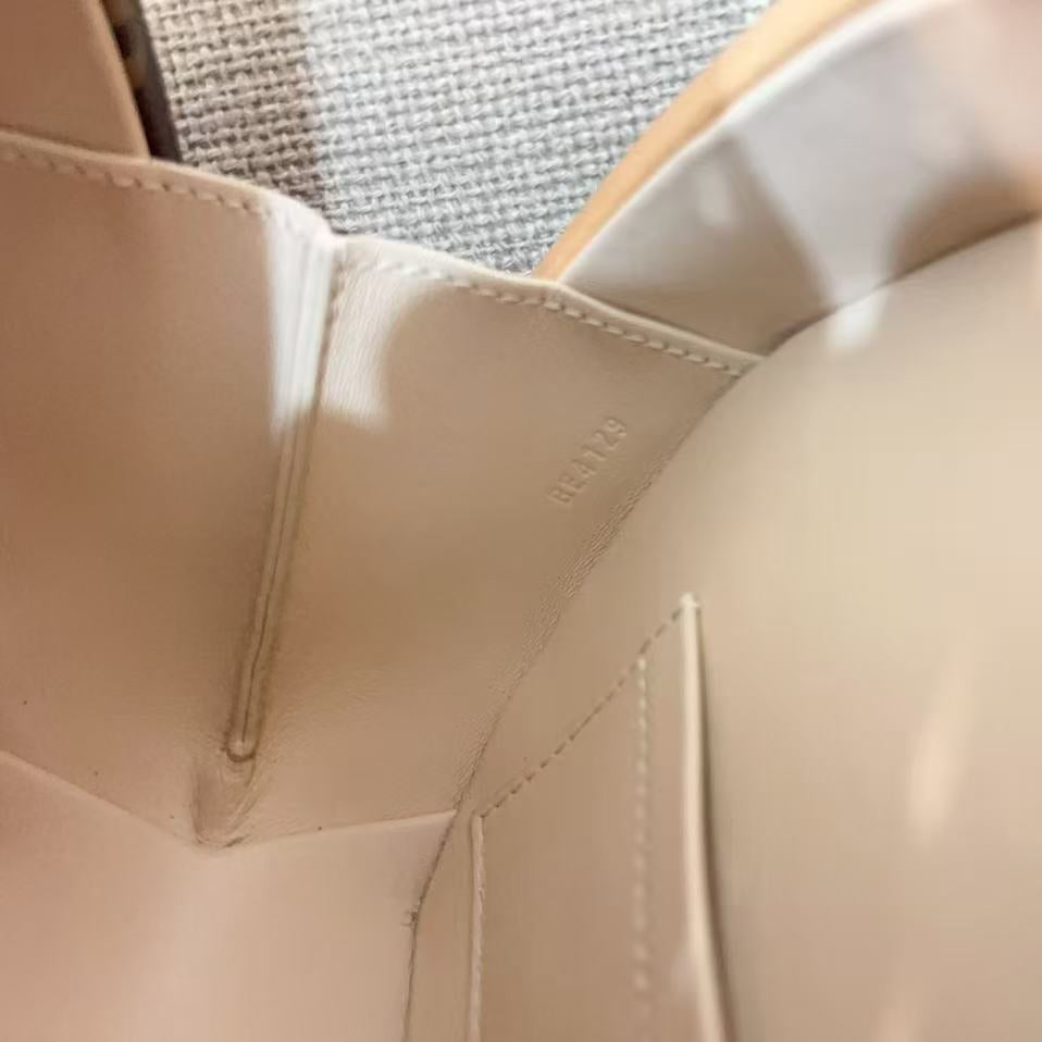 Close-up of a beige car seat with stitching details