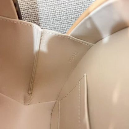 Close-up of a beige car seat with stitching details