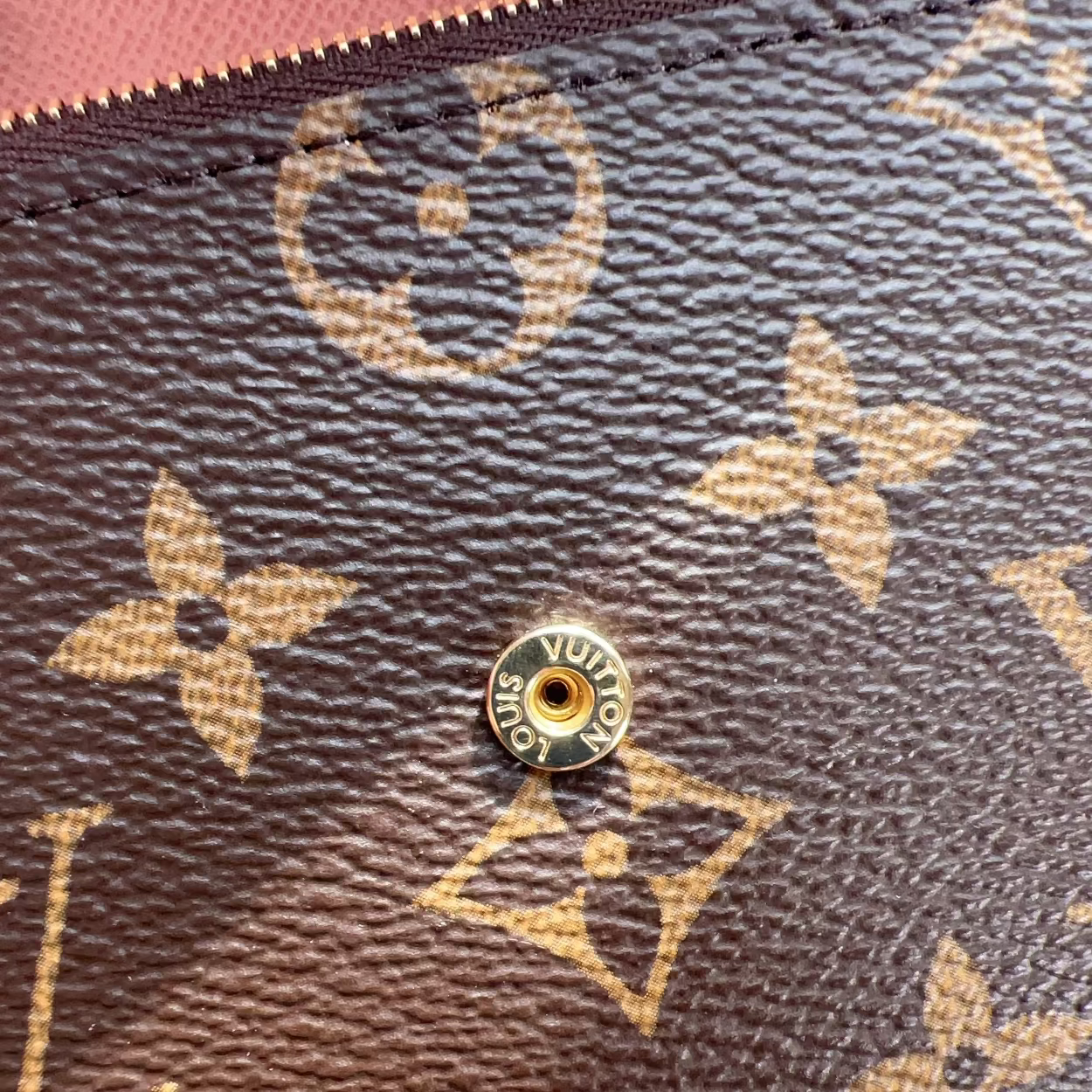 Close-up of a Louis Vuitton wallet with monogram pattern