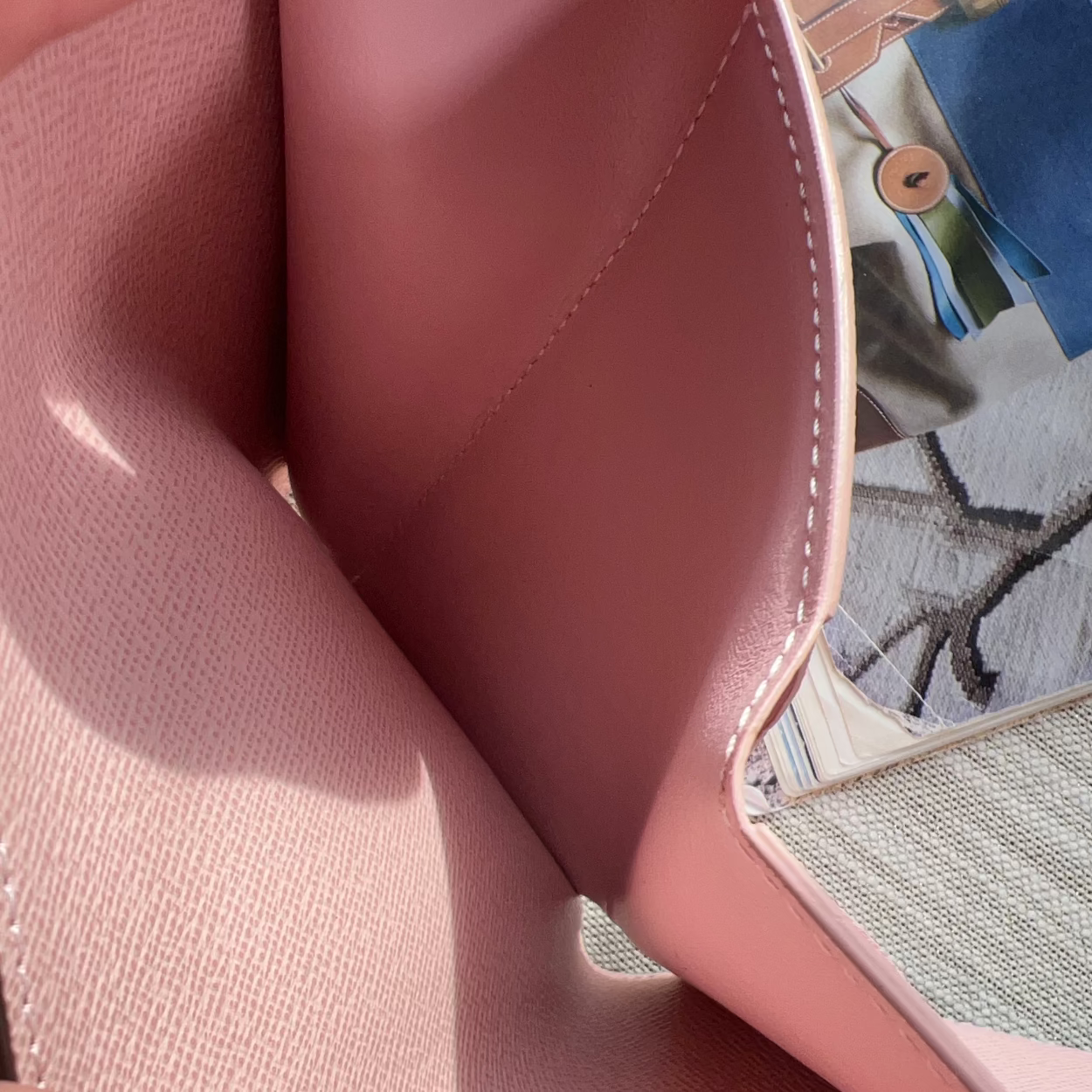 Close-up of a pink leather product with a textured surface