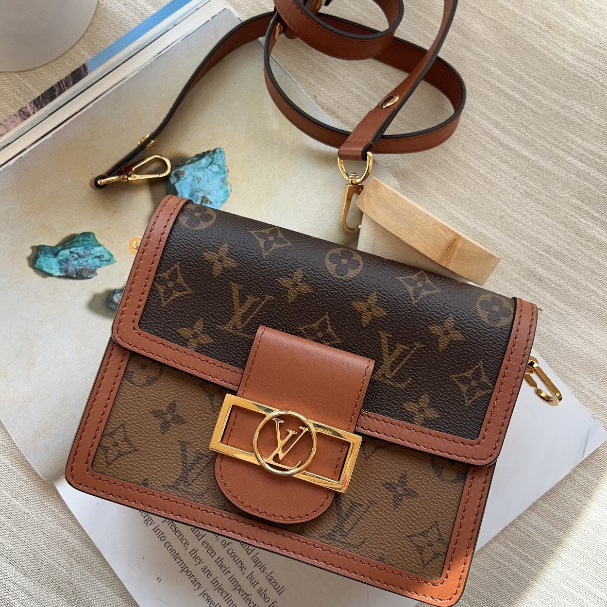 Louis Vuitton wallet with monogram pattern on a textured surface