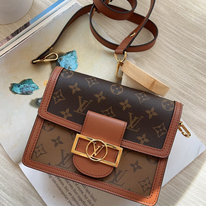 Louis Vuitton wallet with monogram pattern on a textured surface