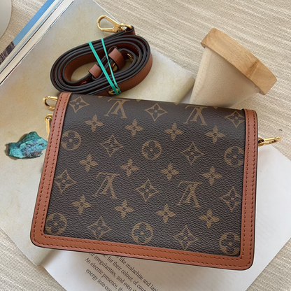 Louis Vuitton wallet with monogram pattern on a textured surface