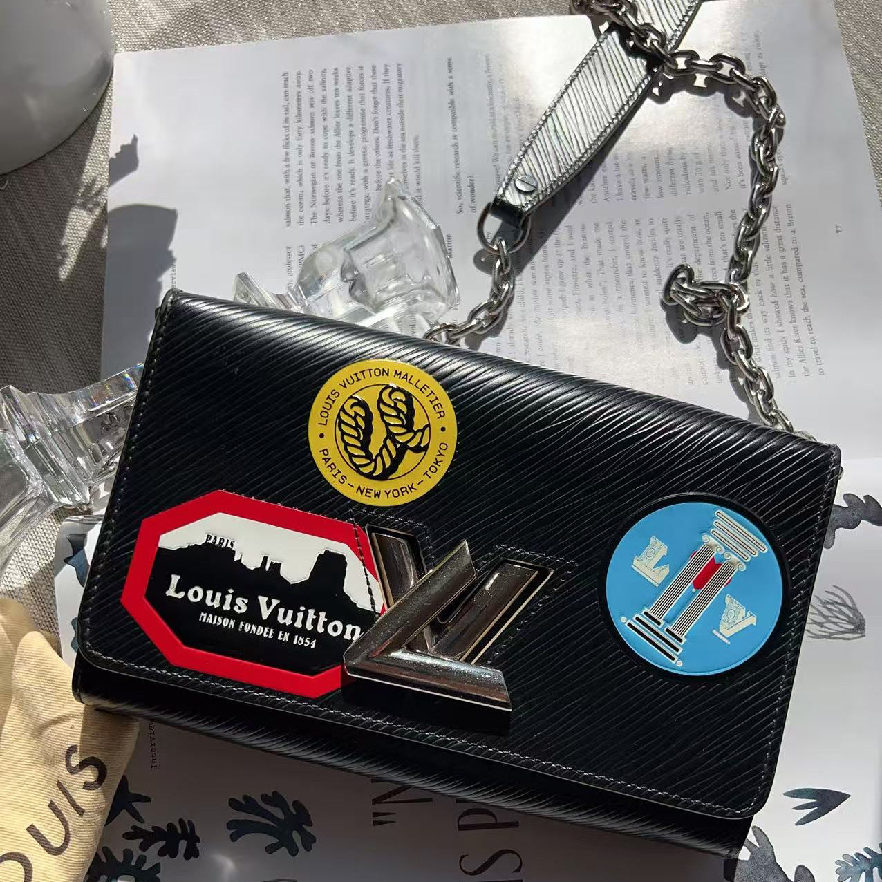 Black handbag with colorful patches 