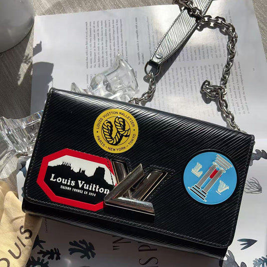 Black handbag with colorful patches 