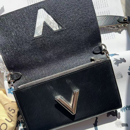 Black handbag with a silver logo 