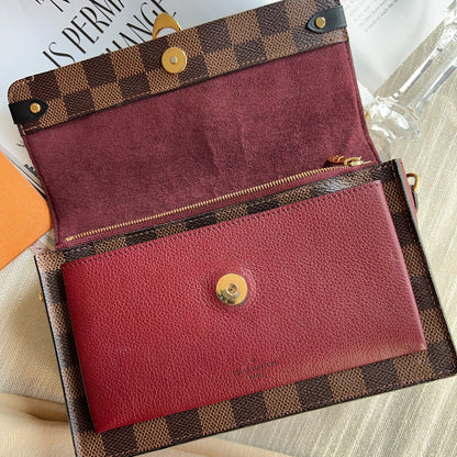Louis Vuitton wallet with checkered exterior on a surface