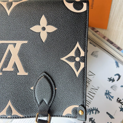 Louis Vuitton handbag with monogram pattern on a surface