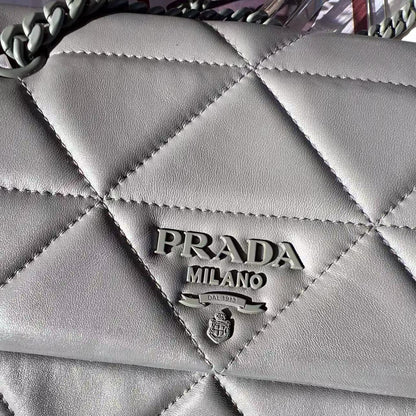 Quilted gray handbag with Prada logo