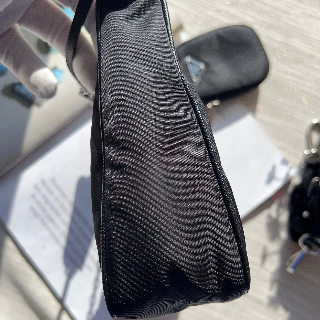 Black pouch on a textured surface