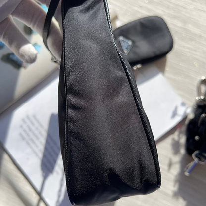 Black pouch on a textured surface