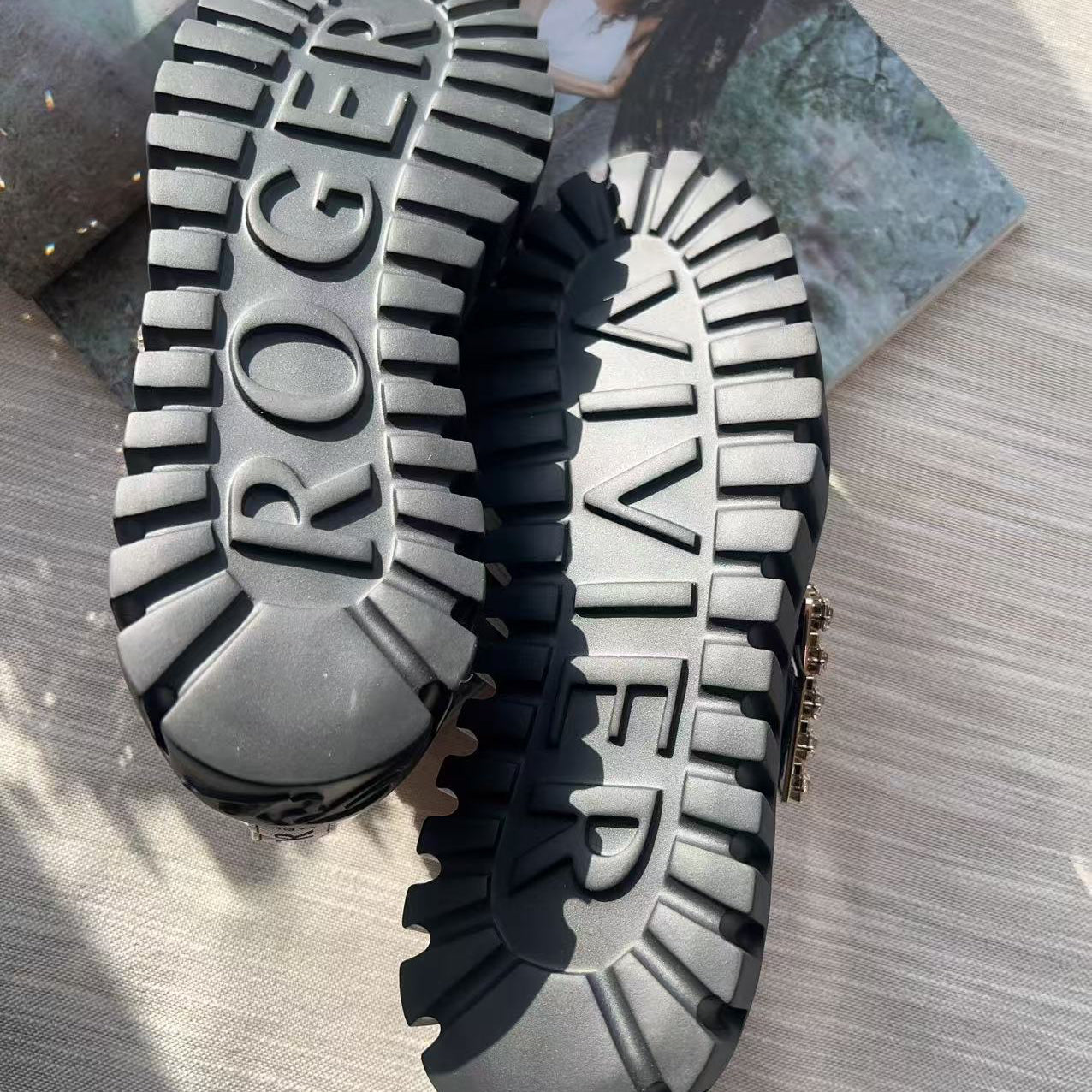 Close-up of a shoe sole with 'Roger Vivier' branding on a textured surface.