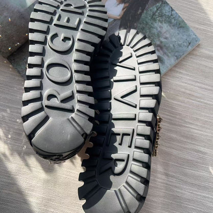 Close-up of a shoe sole with 'Roger Vivier' branding on a textured surface.