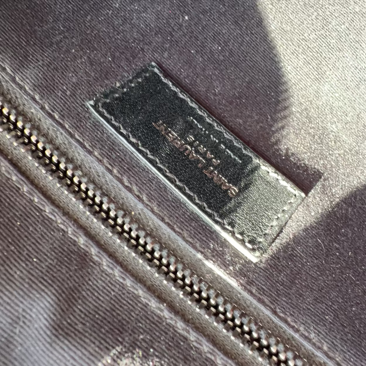 Close-up of a brand label on a textured surface