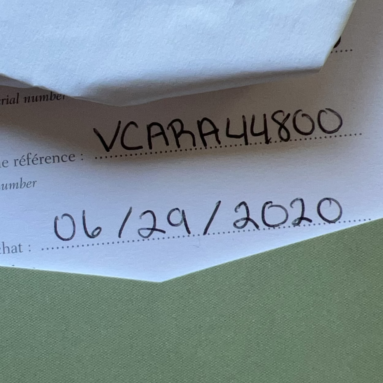 Document with handwritten text and numbers on a white background