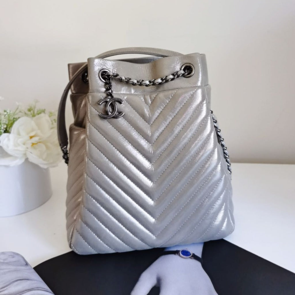 CHANEL SILVER METALLIC CHEVRON QUILTED CALFSKIN LEATHER SMALL BUCKET BAG - luxhub.ca